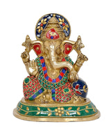 Brass Ganesha statue, front view with blue crown and red-blue patterned robe