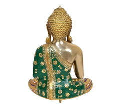 Rear view of brass seated Buddha idol, green robe with gold floral motifs, arched headpiece