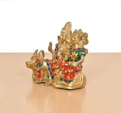Brass Shiv family idol with nandi, colorful garlands and red-green motifs