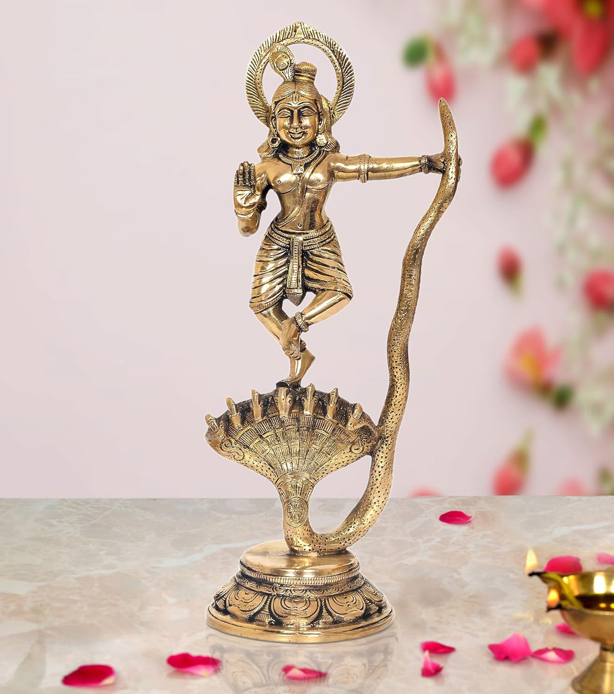 Brass Krishna deity dancing on Kaliya serpent, detailed home temple statue