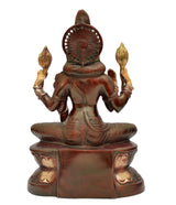 Lakshmi statue from behind view, arched halo and seated lotus base details