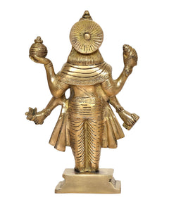Brass Dhanvantri statue rear view, large circular headpiece, gold-tone robe and arms.