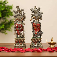 Bronze Radha-Krishna idol pair, detailed back view with red-gold patterned lower garments