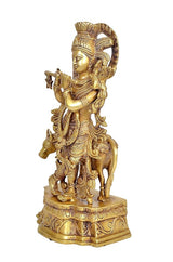 Brass Lord Krishna statue, profile view on pedestal, raised arms with ornate jewelry