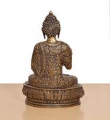 Back view of brass Abhaya mudra Buddha idol, ornate robe pattern on circular pedestal