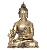 Brass meditating Buddha idol, lotus flower in hand, serene face, seated
