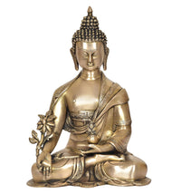 Brass meditating Buddha idol, lotus flower in hand, serene face, seated