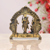 Bronze-finish Ram Darbar statue from behind with ornate arch and central standing figure