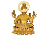 Brass Lakshmi idol from behind, circular halo, seated lotus base, four arms raised