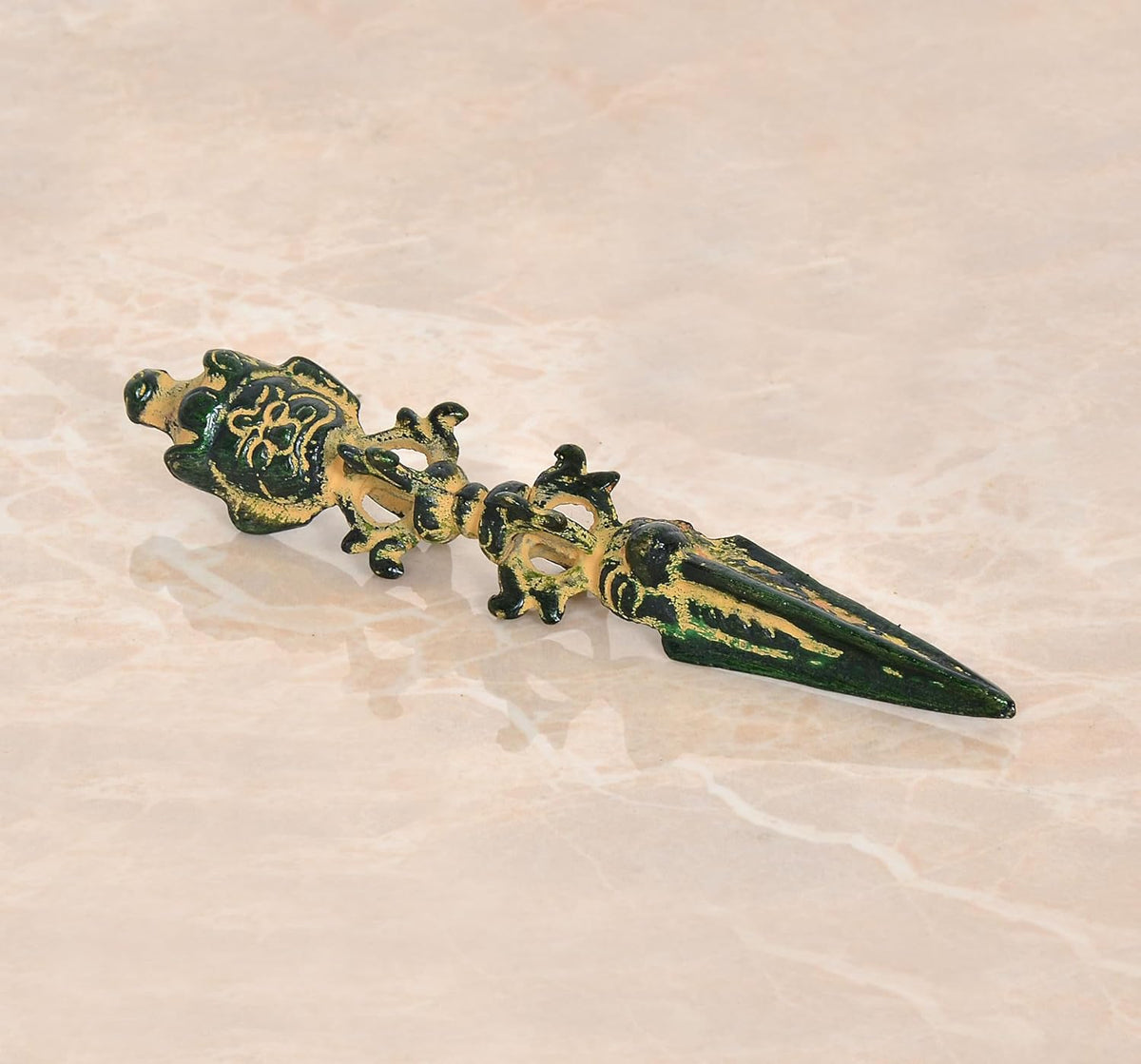 Multicolor Tibetan phurpa dagger pendant with brass-toned gold motifs, front view