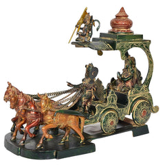 Brass chariot statue with Hanuman figure, decorated horses, and deity riders on chariot.