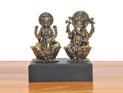 Front view of bronze Lakshmi and Ganesh mini statues seated on lotus bases.