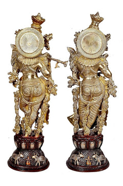 Brass Radha Krishna sculpture, rear view with circular halo discs and winged ornaments