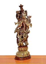 Krishna brass flute sculpture, opposite angled side view with intricate armor-like detailing