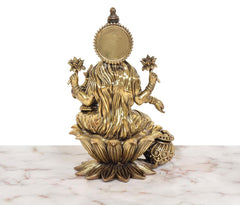 Superfine Brass Lakshmi idol, rear view with round halo and draped back detailing