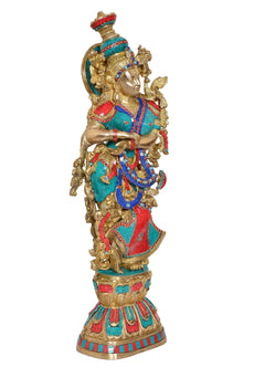 Radha Rani Brass idol statue, three-quarter view with teal-blue and red skirt
