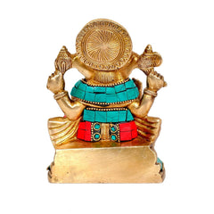 Brass Ganesha statue with teal and red stone work, rear view