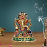 Brass Ganesha religious statue with colorful gemstone-style detailing, raised hands