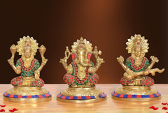 Brass Lakshmi Ganesh Saraswati idols with multicolor paint, seated on round bases