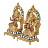 Brass Lakshmi-Ganesh idol figures, two seated deities with colorful bead details