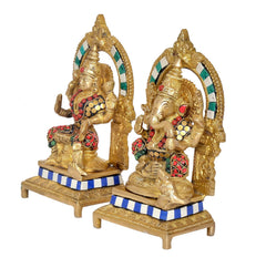 Brass Lakshmi-Ganesh idol figures, two seated deities with colorful bead details