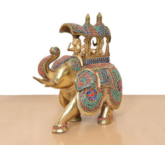 Rear three-quarter view brass king riding elephant statue with multicolor ornamented armor