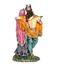 Back view of Radha-Krishna idol statue, Krishna holding a flute behind