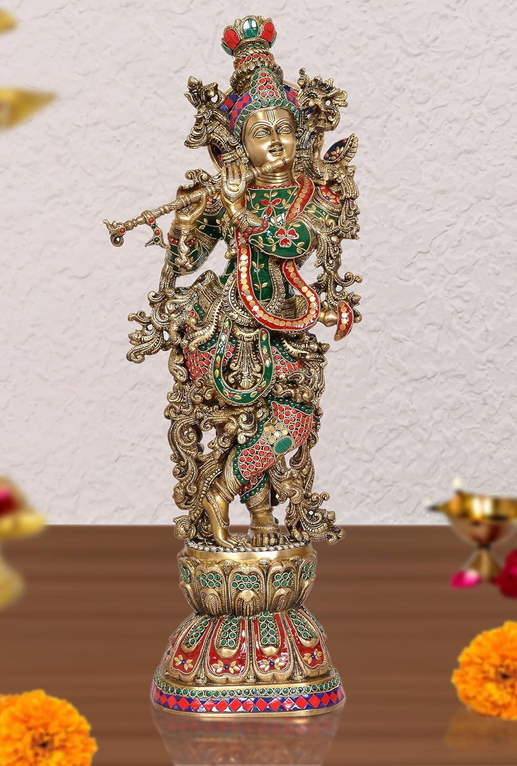 Brass Krishna sculpture, detailed standing figure with colorful green and red attire