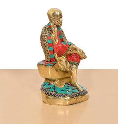 Back/side view of Shirdi Sai Baba brass statue, multicolor robe details on seated base