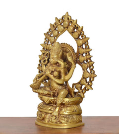Brass Saraswati statue, side view with ornate halo ring and seated veena pose