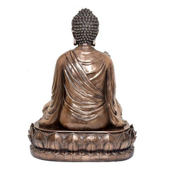 Resin Buddha idol, rear view, textured hair and draped robe folds, ornate lotus base