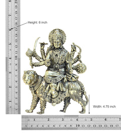 6 inch brass Durga Maa on lion statue, height and width shown on ruler