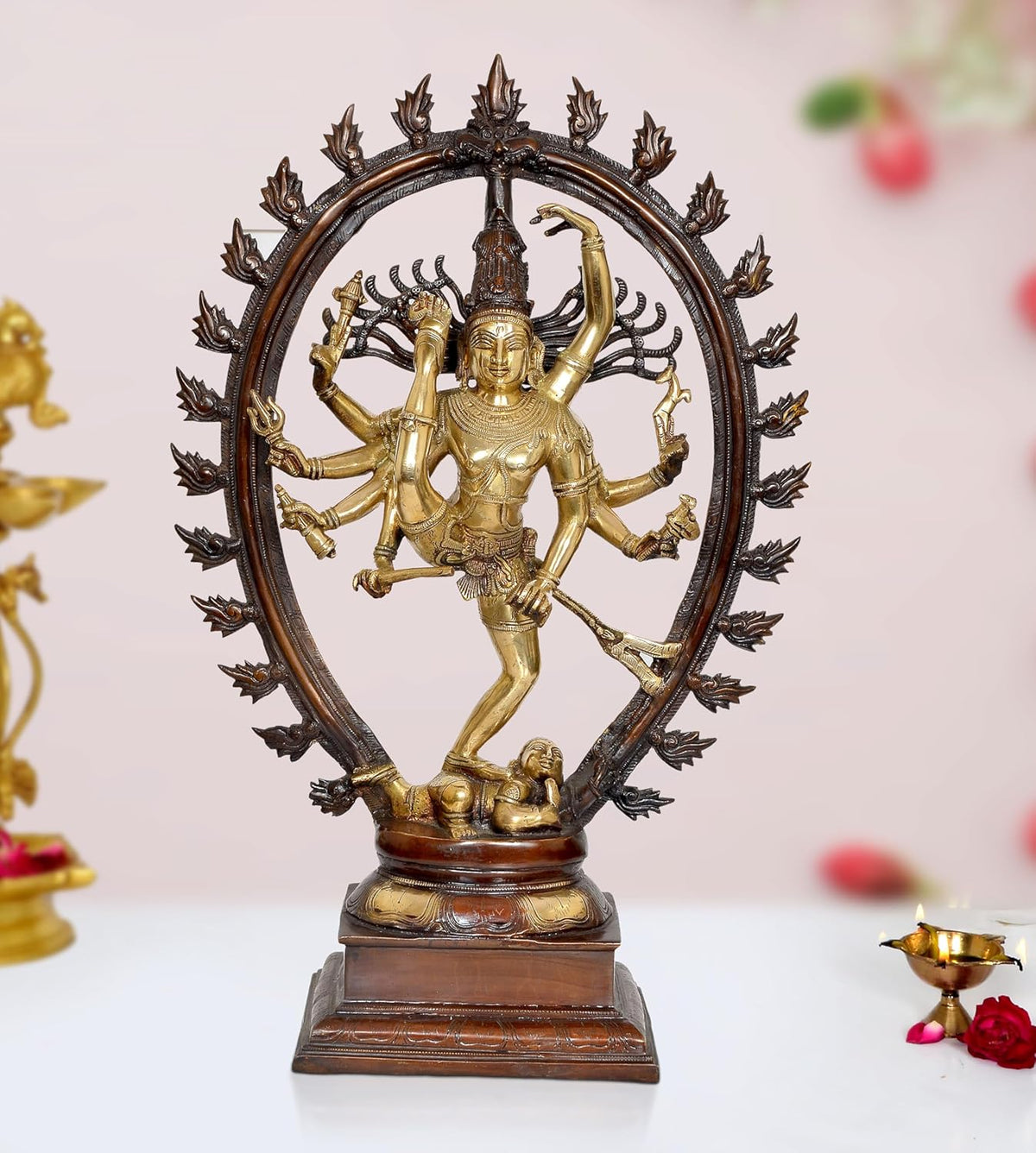 Brass Natraj dancing showpiece with one leg raised, ornate halo and multi-armed figure