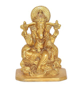 Golden Ganesha statue idol, raised arms and halo backplate, detailed ornamentation