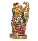 Brass laughing Buddha statue in a leaning pose, raised hands, colorful mosaic-style robe
