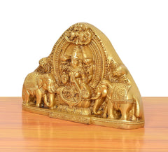 Gold brass Gaja Lakshmi idol with elephants, side angle, detailed front scene