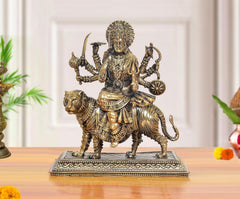 Brass Durga Maa idol on tiger; 7 in tall, seated goddess with many arms