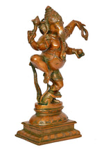 Dancing Ganesha brass statue shown from front-left angle with ornate belt and jewelry