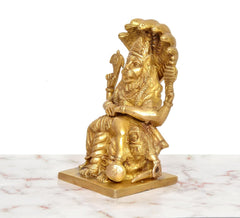 Brass Narasimha statue side view, lion head and raised mace details
