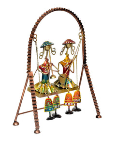 Jhula showpiece decor with two musicians in colourful dresses and hanging bell ornaments