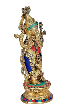Brass Krishna playing flute figurine, holding flute, blue drape and red sash, 12-inch