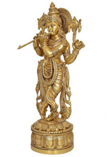 Krishna brass statue playing flute, side view with ornate halo and detailed ornaments