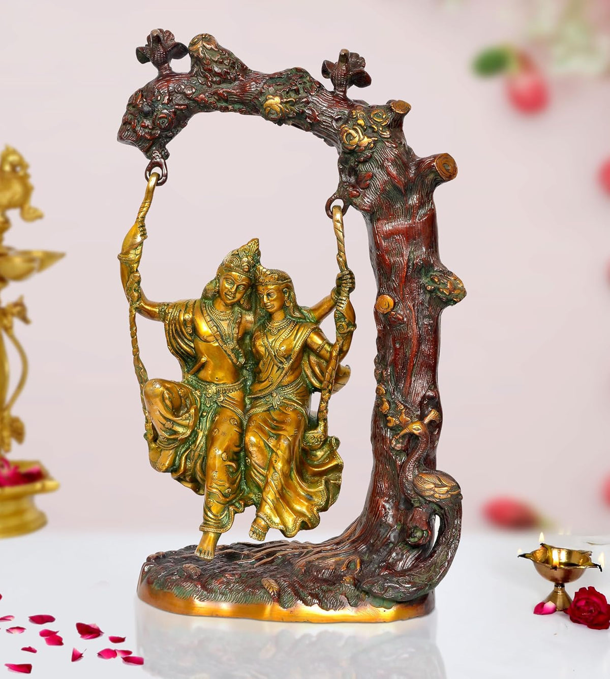 Brass Radha Krishna swing idol statue, two figures seated with golden swing ropes
