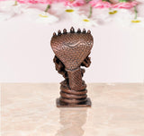 Lakshmi Varaha copper statue back view with serpent scale pattern on hood