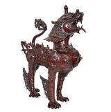Temple lion statue, metallic dark red-brown finish, side view, ornate plated torso and legs