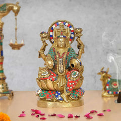 Brass Lakshmi idol holding pot of money, seated with colorful beaded details
