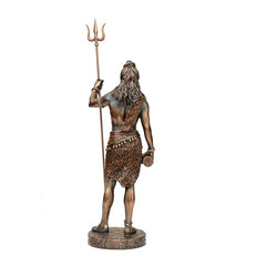 Back view of Shiva statue holding trishul, bronze-tone, textured loincloth and beads