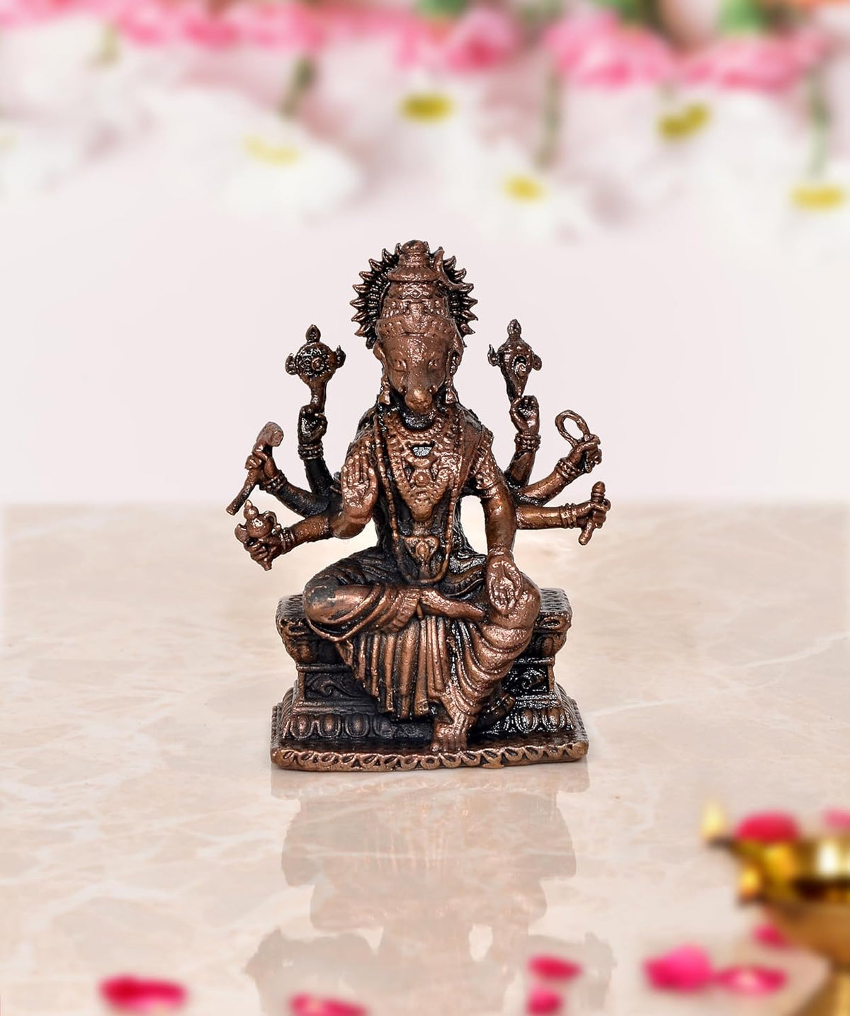 Copper Varahi idol sculpture, eight-armed deity seated on pedestal, 3 inches tall