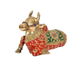 Brass Nandi statue side view, gold body with red and green painted panels
