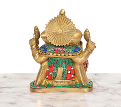 Brass Ganpati idol from back, crown and torso with turquoise and red jeweled bands